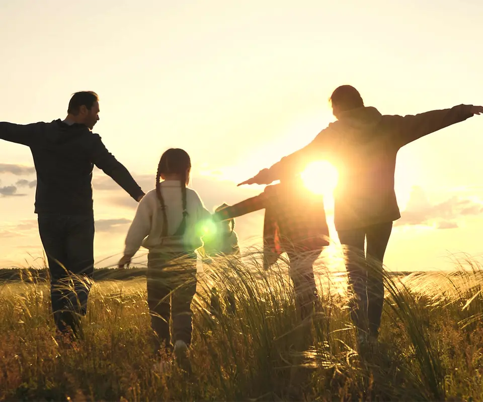 A family raising their hands.